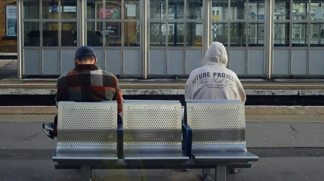 Commuters waiting at a public transport station